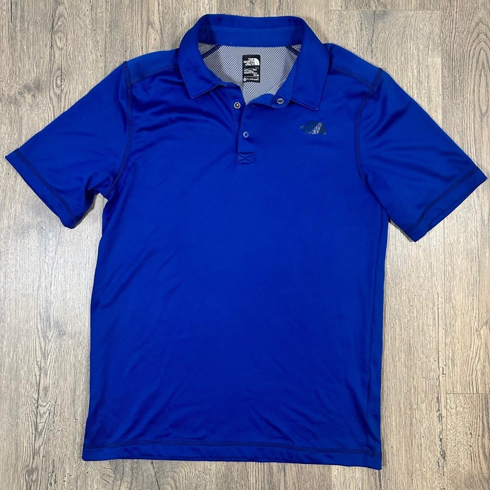 The North Face blue polo shirt in size M